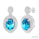 1/20 ctw Oval Cut 7X5MM Blue Topaz and Round Cut Diamond Semi Precious Earring in Sterling Silver